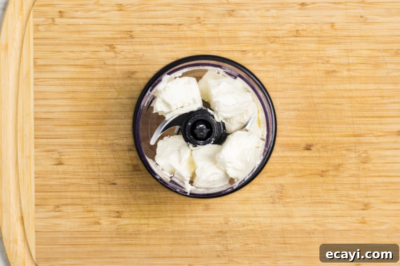 Creamy Shrimp Delight 6 cubed cream cheese ready in the bowl of a mini food chopper