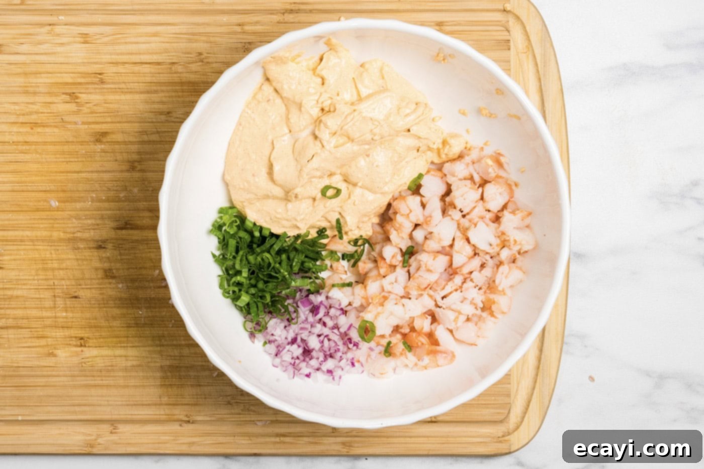 Creamy Shrimp Delight 8 Photo of all shrimp dip ingredients combined in a mixing bowl, ready for chilling