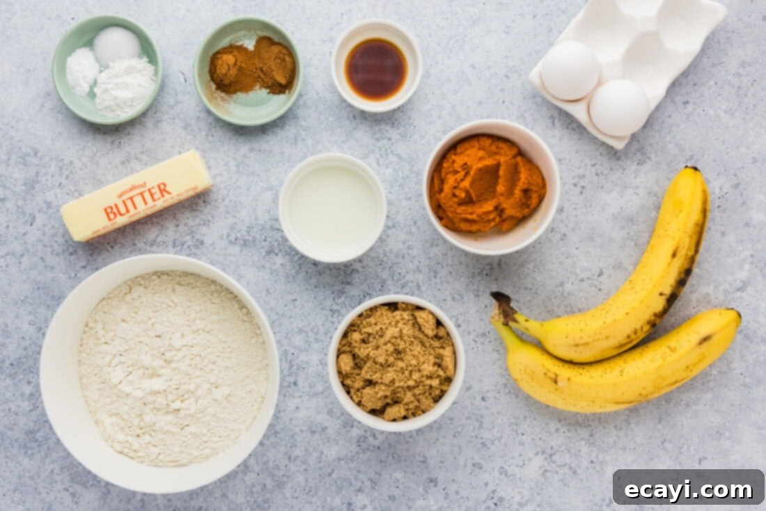 Golden Harvest Pumpkin Banana Muffins 4 A collection of fresh ingredients laid out for making Pumpkin Banana Muffins