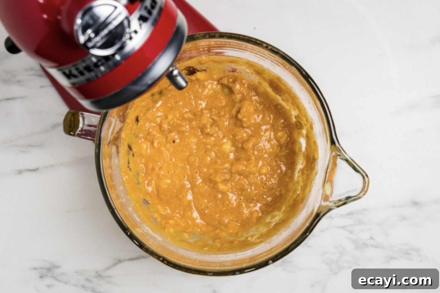 Golden Harvest Pumpkin Banana Muffins 7 The vibrant pumpkin puree and mashed bananas mixed into the butter and sugar mixture in a stand mixer bowl
