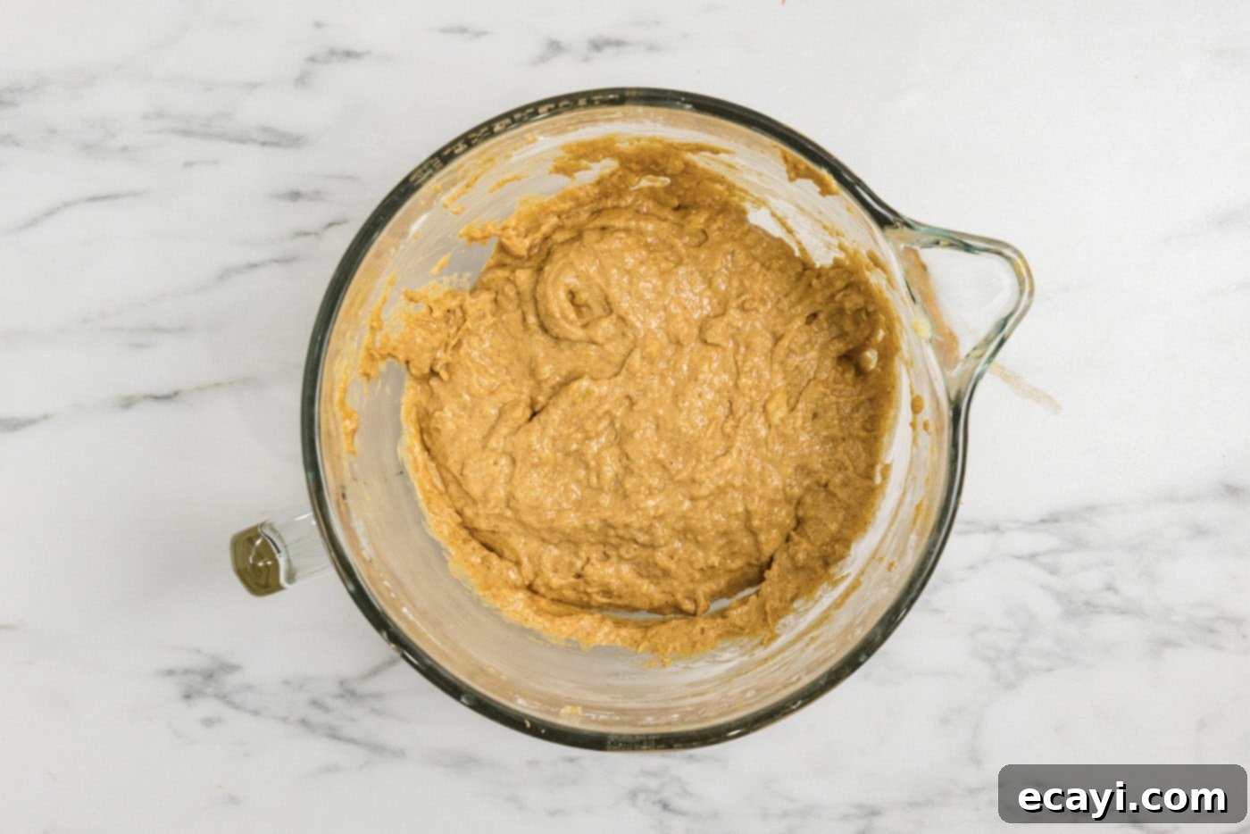 Golden Harvest Pumpkin Banana Muffins 10 Pumpkin banana muffin batter resting in a bowl, allowing flavors to meld and flour to hydrate
