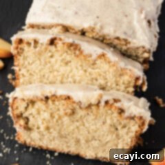 Spiced Apple Cider Pound Cake 15 Close up photo of two slices of Apple Cider Pound Cake resting on the loaf