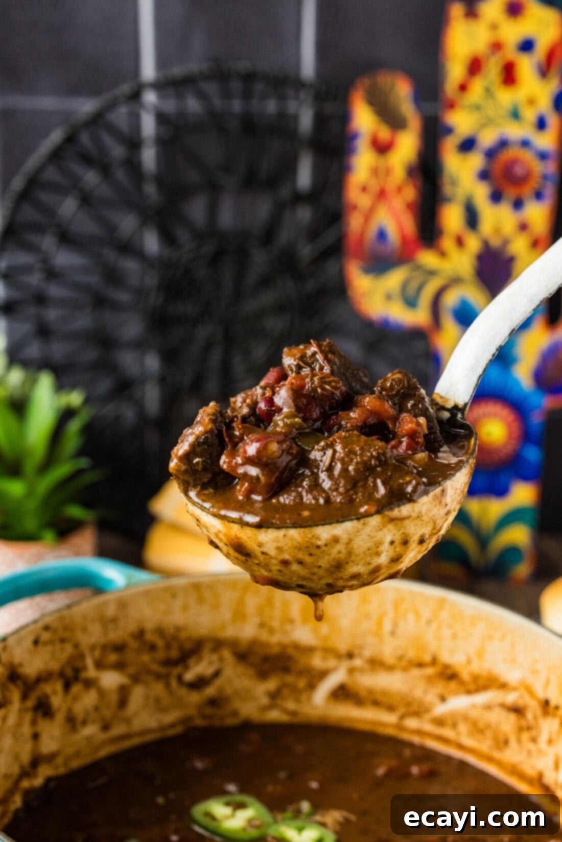 Fork-Tender Short Rib Chili 2 Ladle of Short Rib Chili held over a pot, showcasing its rich texture and color