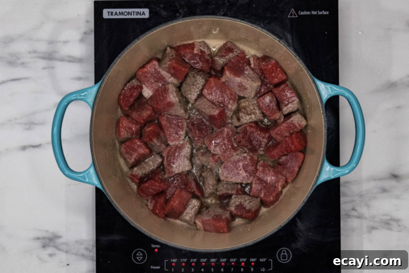 Fork-Tender Short Rib Chili 5 cubed beef short ribs searing in a dutch oven, creating a delicious crust