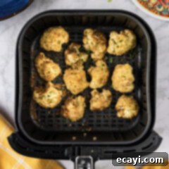 Crispy Air Fried Cauliflower 11 Close up photo of a basket of Air Fryer Fried Cauliflower