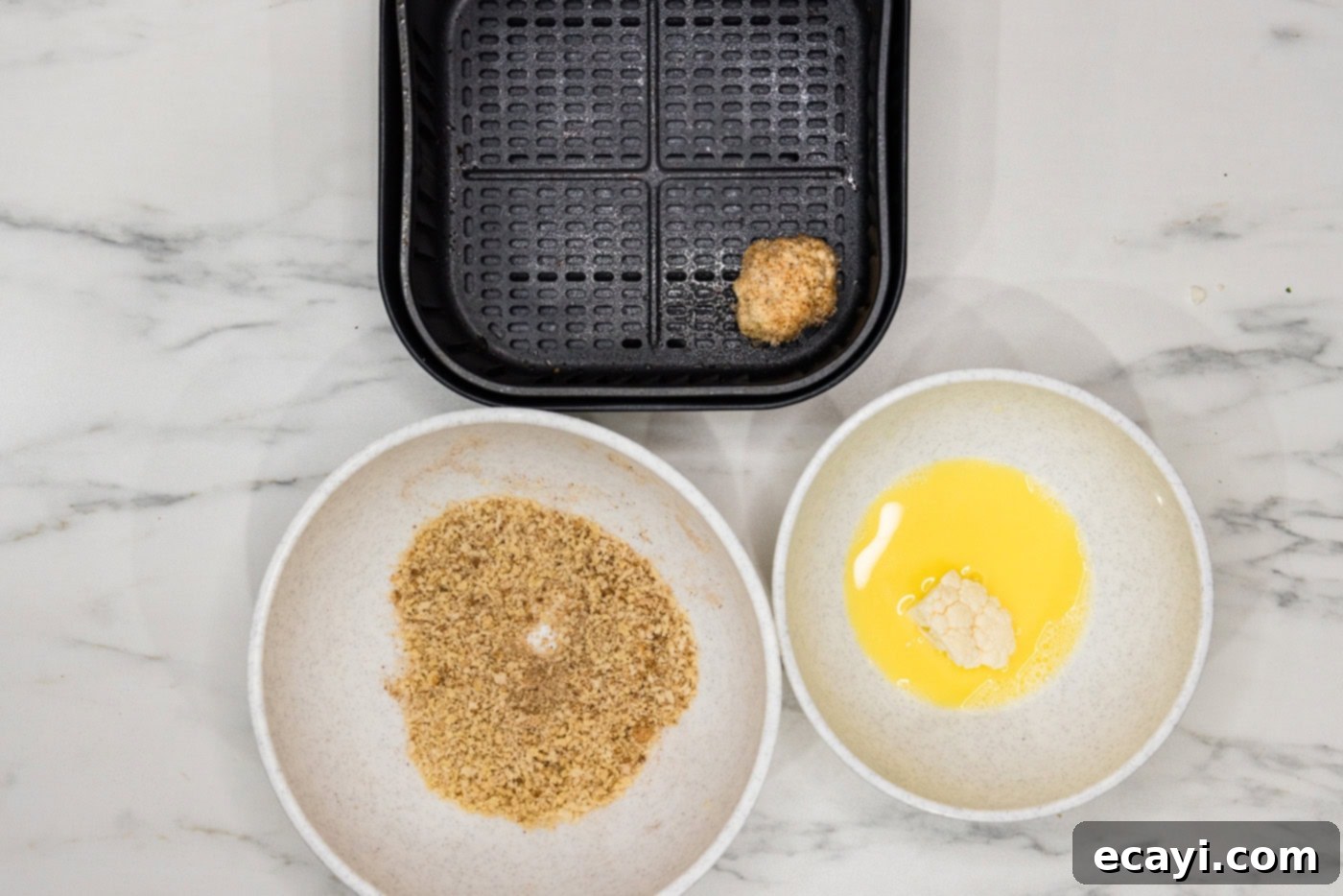Crispy Air Fried Cauliflower 8 panko coated cauliflower floret in an air fryer basket
