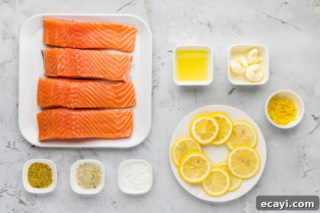 Zesty Lemon Salmon Bake 4 A vibrant flat lay of all the fresh ingredients needed for Baked Lemon Salmon, including salmon fillets, fresh lemons, butter, and seasonings.