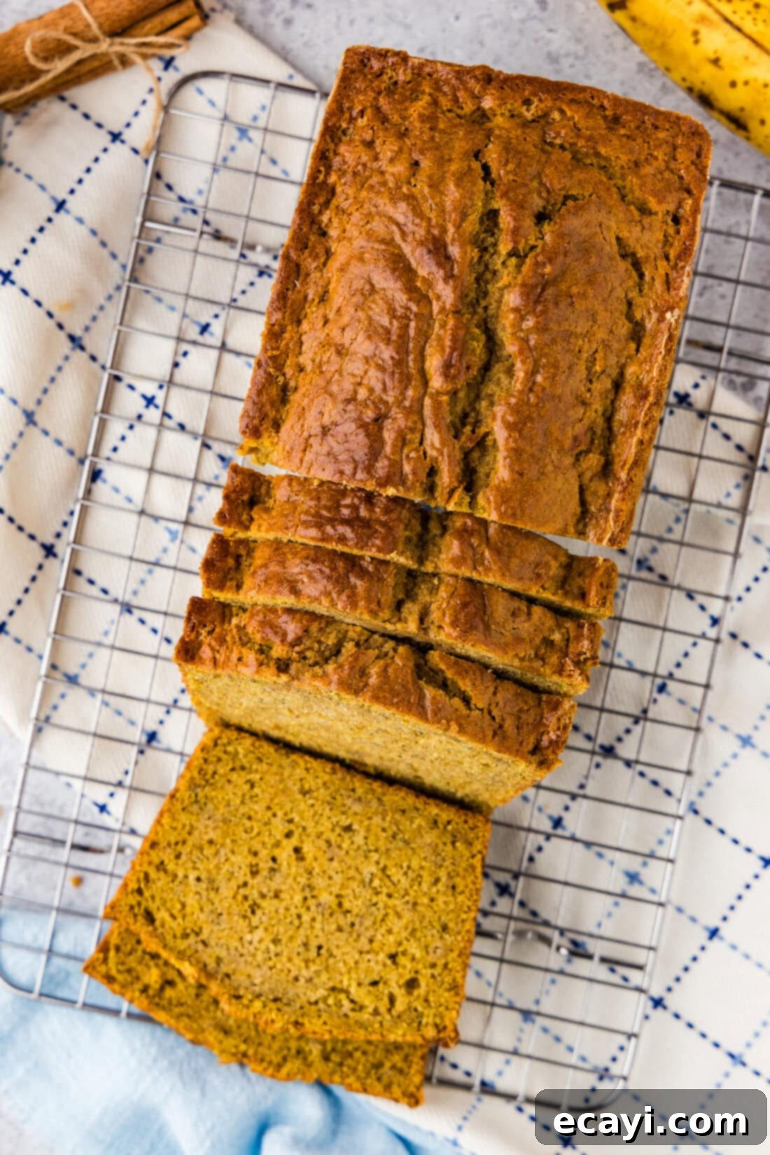 Spiced Pumpkin Banana Loaf 2 Pumpkin Banana Bread cut into slices on a wire rack