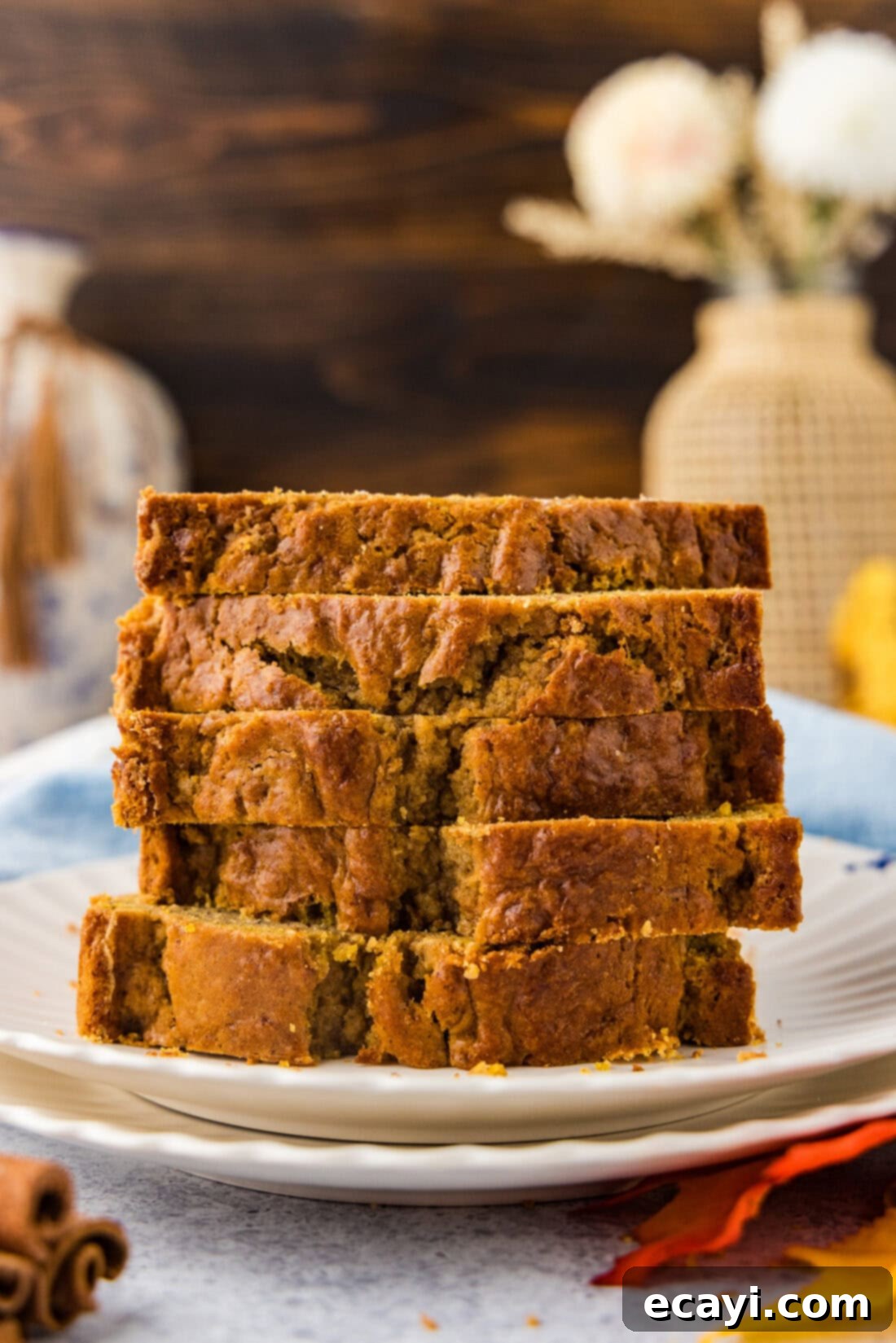 Spiced Pumpkin Banana Loaf 3 Stack of Pumpkin Banana Bread slices on a plate