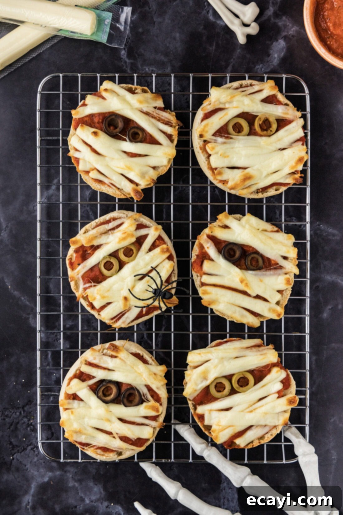 Mummy Mini Pizza Bites 9 Mini Mummy Pizzas on a wire rack
