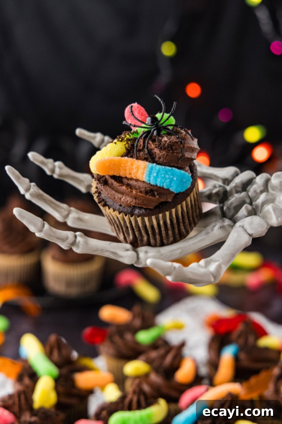 Graveyard Crumble Cups 3 Skeleton hand holding a Halloween Dirt Cupcake
