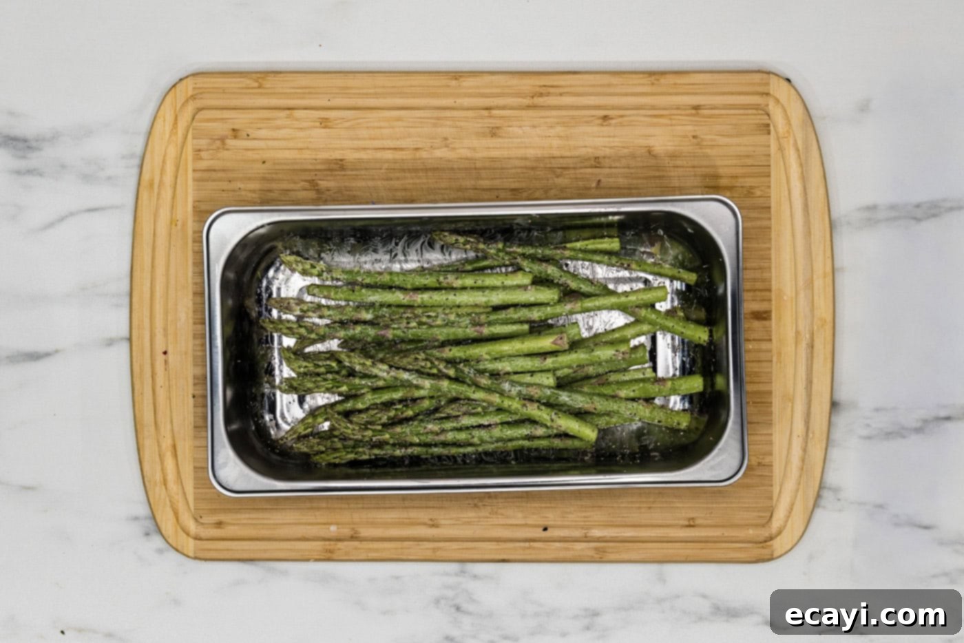 Quick and Tender Instant Pot Asparagus 6 butter coated asparagus seasoned with garlic salt and black pepper