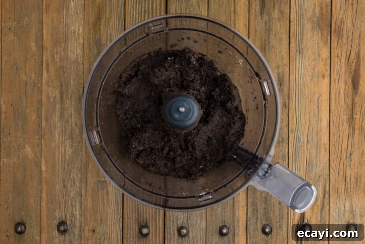 Pharaoh's Pops 7 Oreo and cream cheese mixture combined in a food processor bowl, forming a dense dough