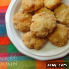 Easy Homemade Chicken Nuggets 6 A close up overhead photo of homemade chicken nuggets on a white plate.