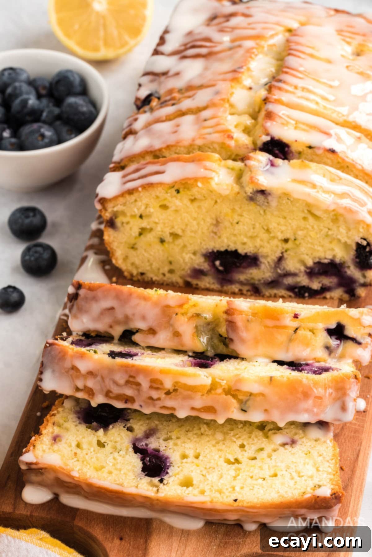 Moist Lemon Blueberry Zucchini Bread with Zesty Glaze - Perfect for Garden Zucchini close up of sliced lemon blueberry zucchini bread