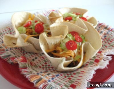 Over 40 Delicious Ground Beef Dinner Recipes 3 A selection of colorful Mini Taco Bowls, filled with delicious toppings.