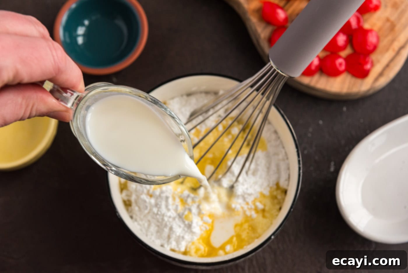 Ruby Maraschino Bundt 13 whisking milk into powdered sugar and melted butter