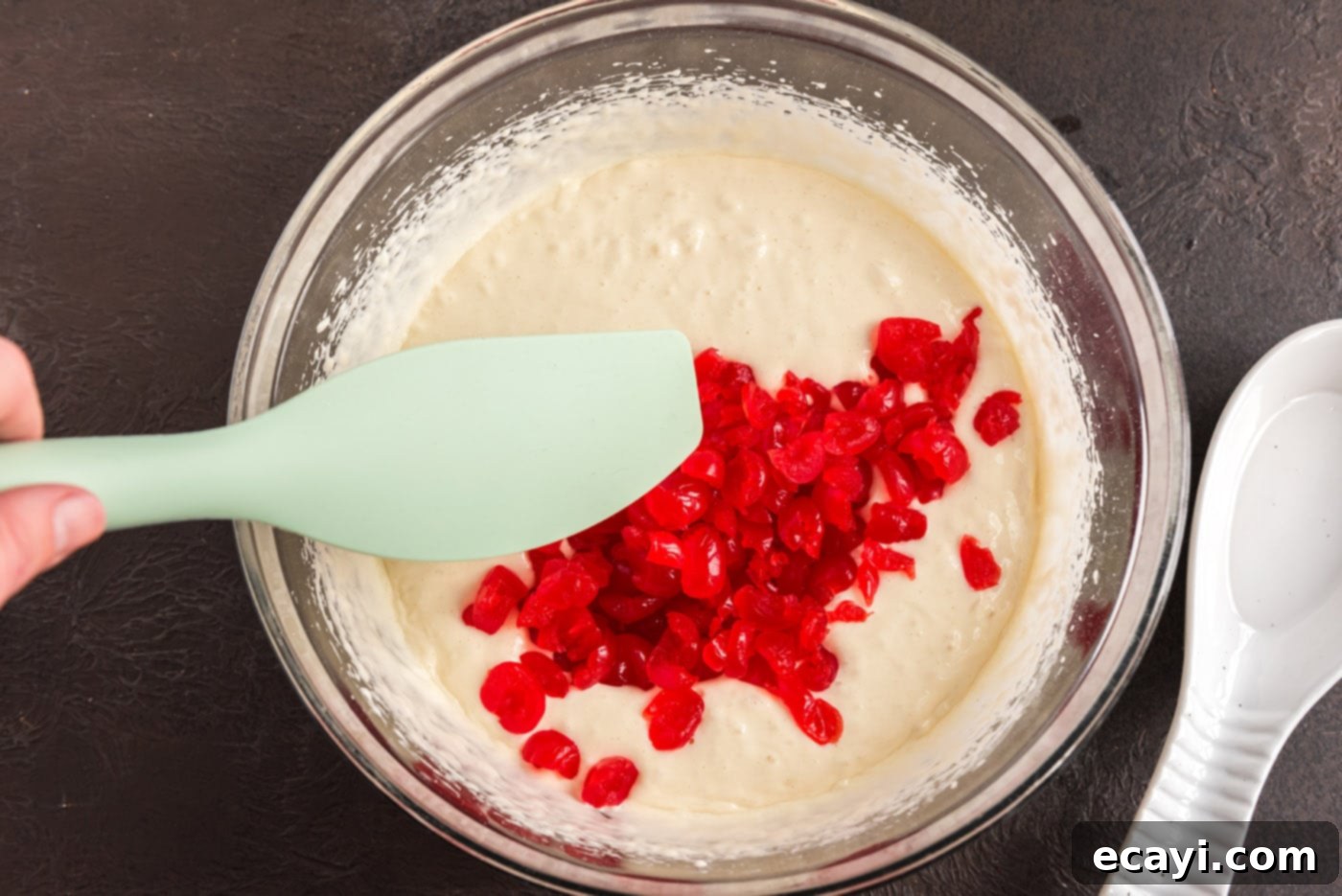 Ruby Maraschino Bundt 9 folding chopped maraschino cherries into cake mix