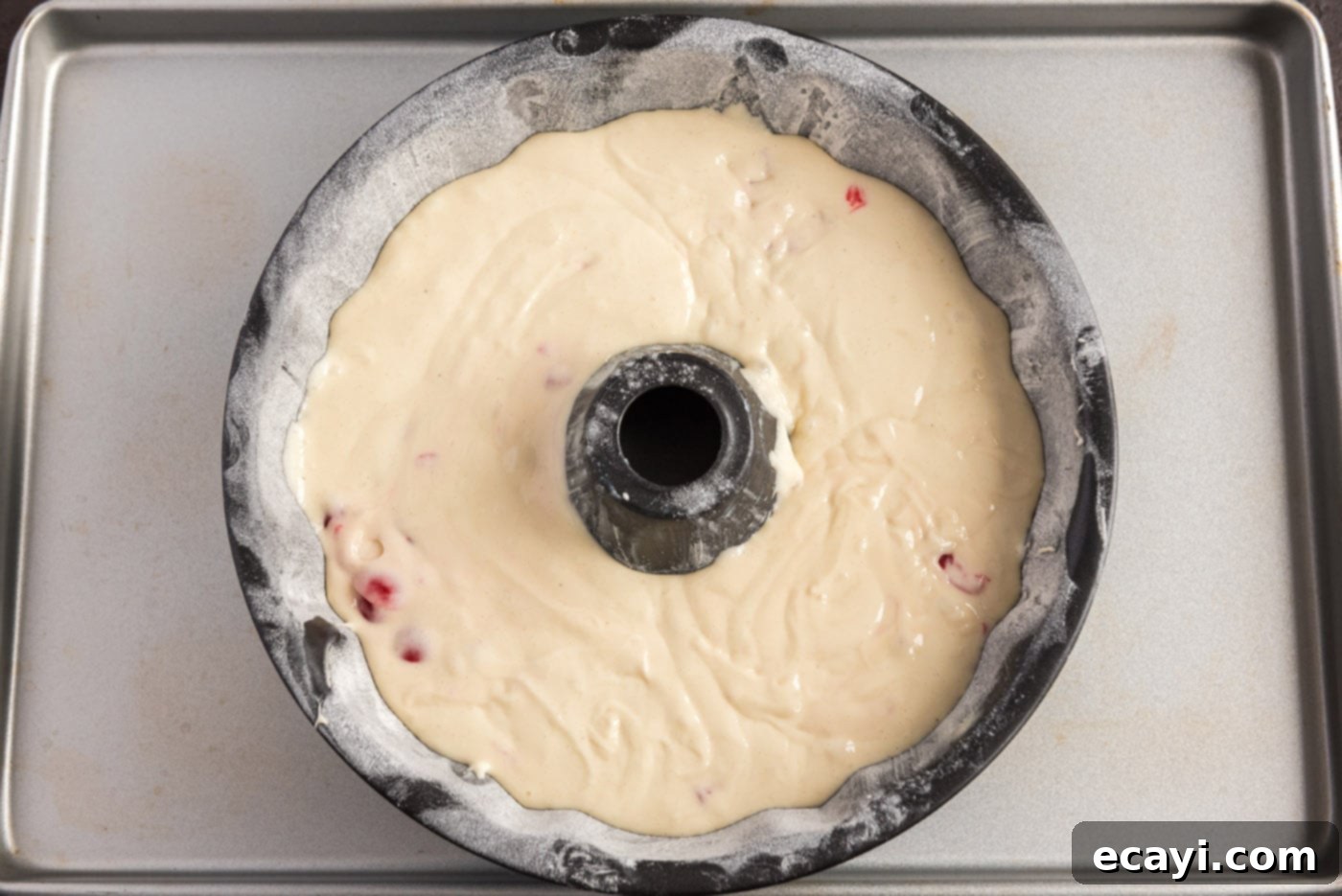 Ruby Maraschino Bundt 10 cake batter with cherries added to bundt pan