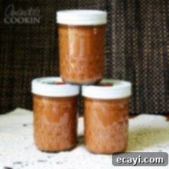 Effortless Crock Pot Apple Butter 2 Three jars of crock pot apple butter.