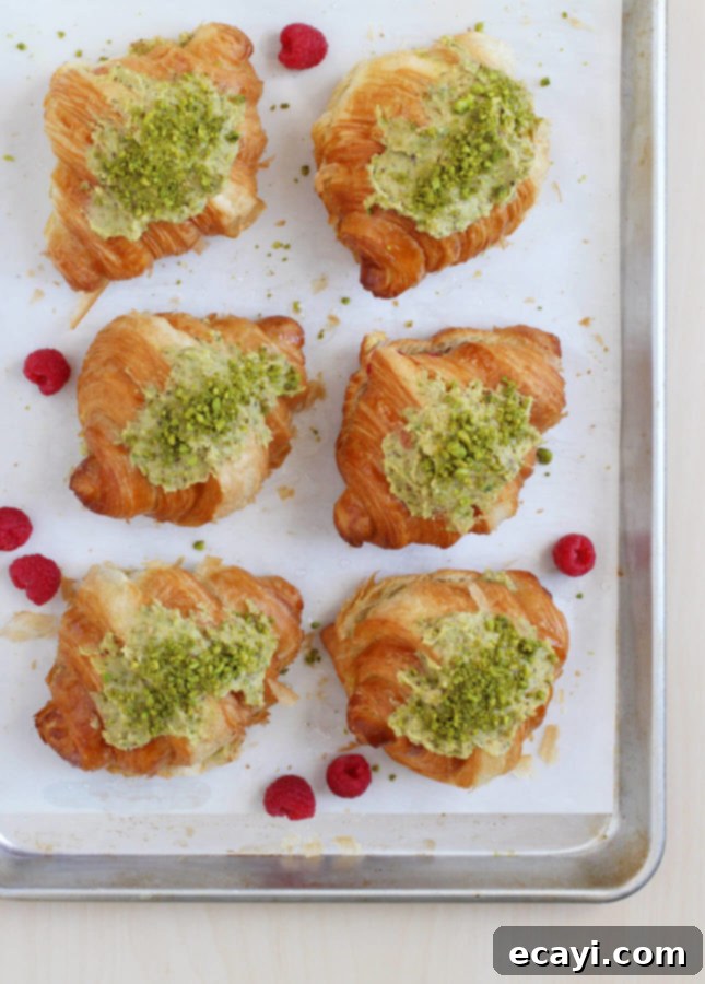 Effortless Pistachio Croissant Indulgence 4 Pistachio Croissants with a rich frangipane filling, ready to be baked to a golden perfection.