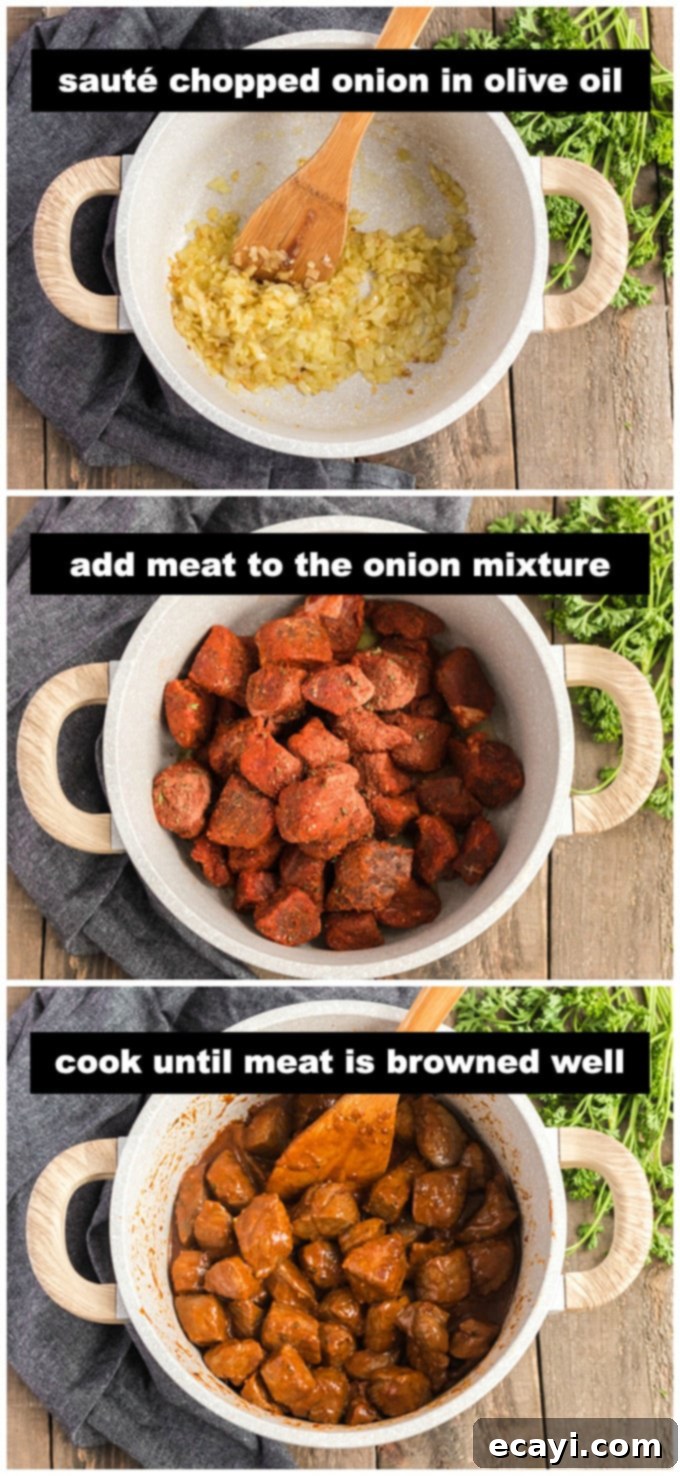 Comforting Homemade Goulash 4 cooking onion and beef chunks in pan