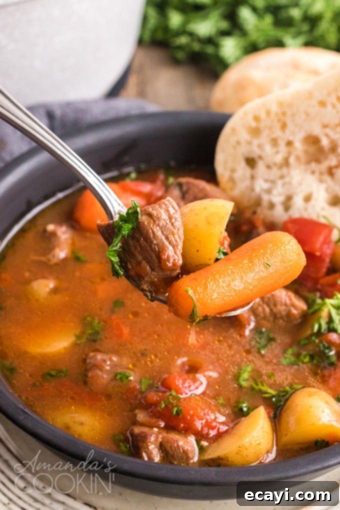 Anytime is the perfect time of year to make this dutch oven goulash. This dutch oven goulash recipe is pure comfort food and so delicious! spoon full of goulash stew