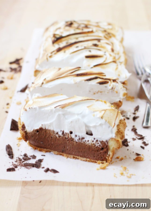 Decadent Chocolate Meringue Dream 3 Close-up of a slice of Chocolate Meringue Pie with a perfect golden meringue and rich chocolate filling