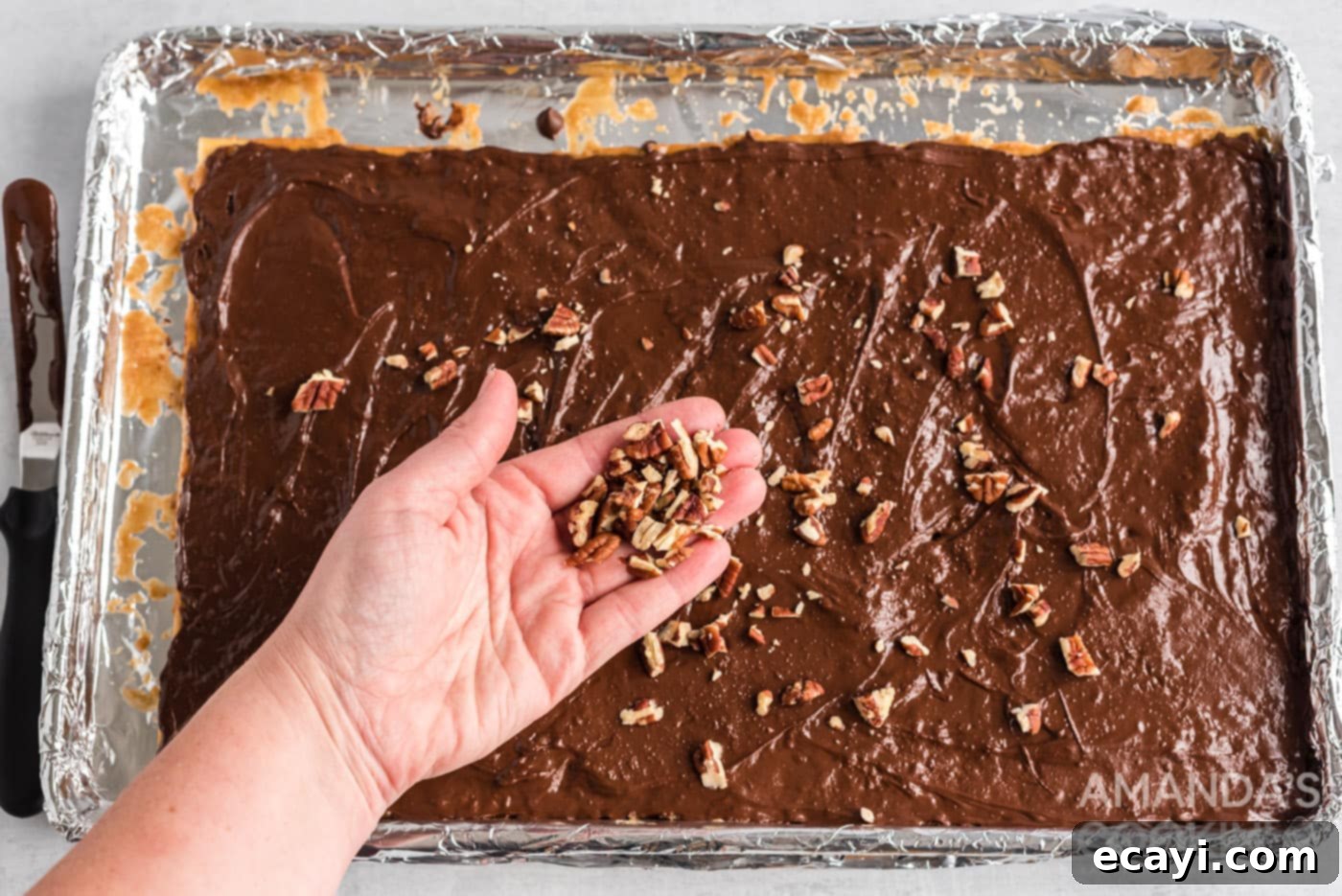 Salty Sweet Toffee Crunch 12 chopped nuts sprinkled on top of saltine toffee