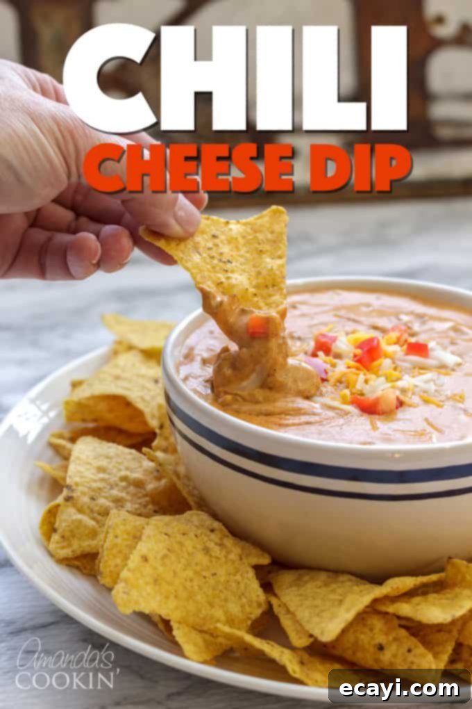 The ultimate easy chili cheese dip for any occasion! large bowl of chili cheese dip with chips