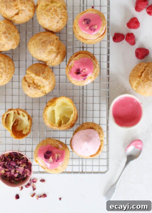 Raspberry Rose Cloud Puffs 5 Rose Raspberry Fool Cream Puffs decorated with rose petals and gold flakes.