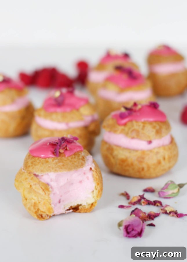 Raspberry Rose Cloud Puffs 7 Beautifully arranged Rose Raspberry Fool Cream Puffs on a serving platter.