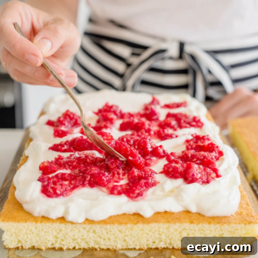 The Ultimate Easy Layered Sheet Cake 5 Assembling the easy layered berry sheet cake with fresh fruit