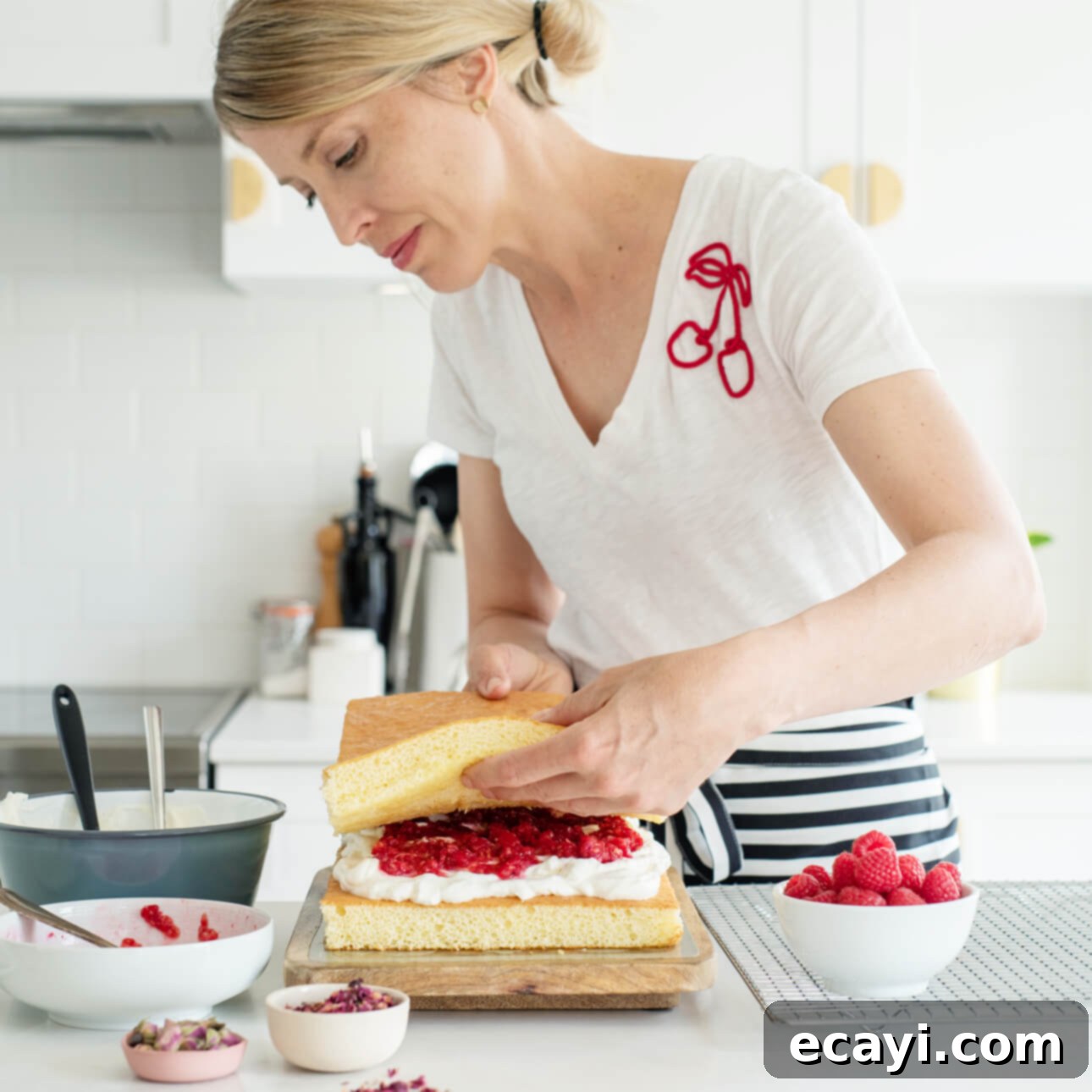 The Ultimate Easy Layered Sheet Cake 6 Close up of a slice of fluffy layered sheet cake with berries and cream