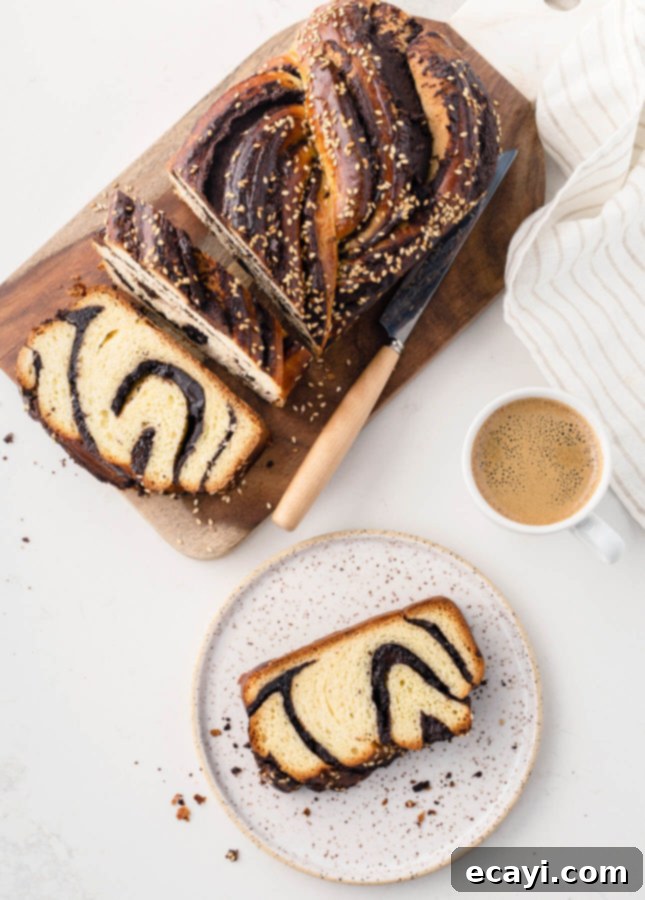 Decadent Tahini Chocolate Babka from Scratch 3 A perfectly baked Tahini and Chocolate Babka with golden-brown crust and visible swirls of chocolate and tahini filling.