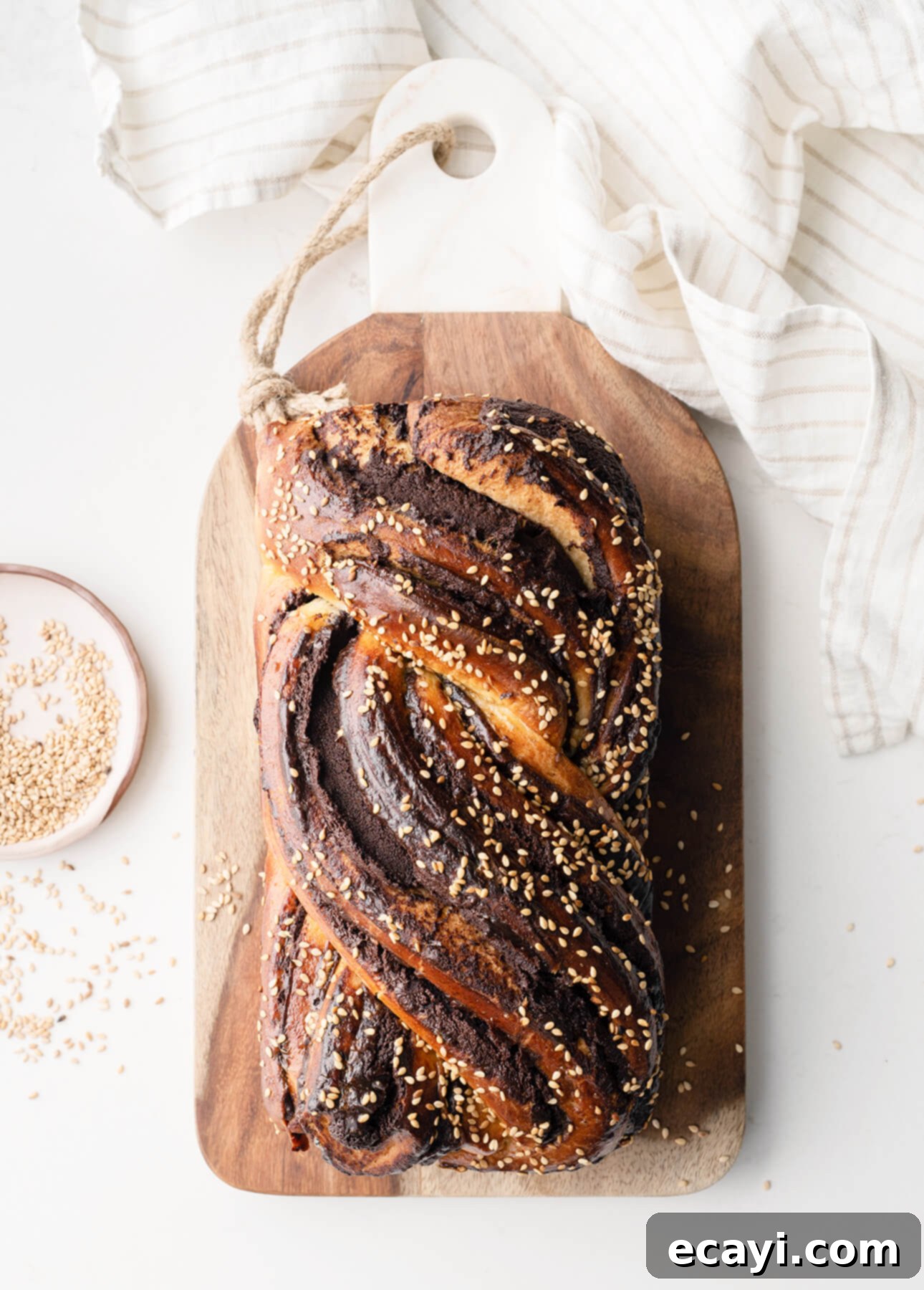 Decadent Tahini Chocolate Babka from Scratch 6 Two freshly baked Tahini & Chocolate Babkas on a cooling rack, showcasing their beautiful twisted patterns and golden crusts.