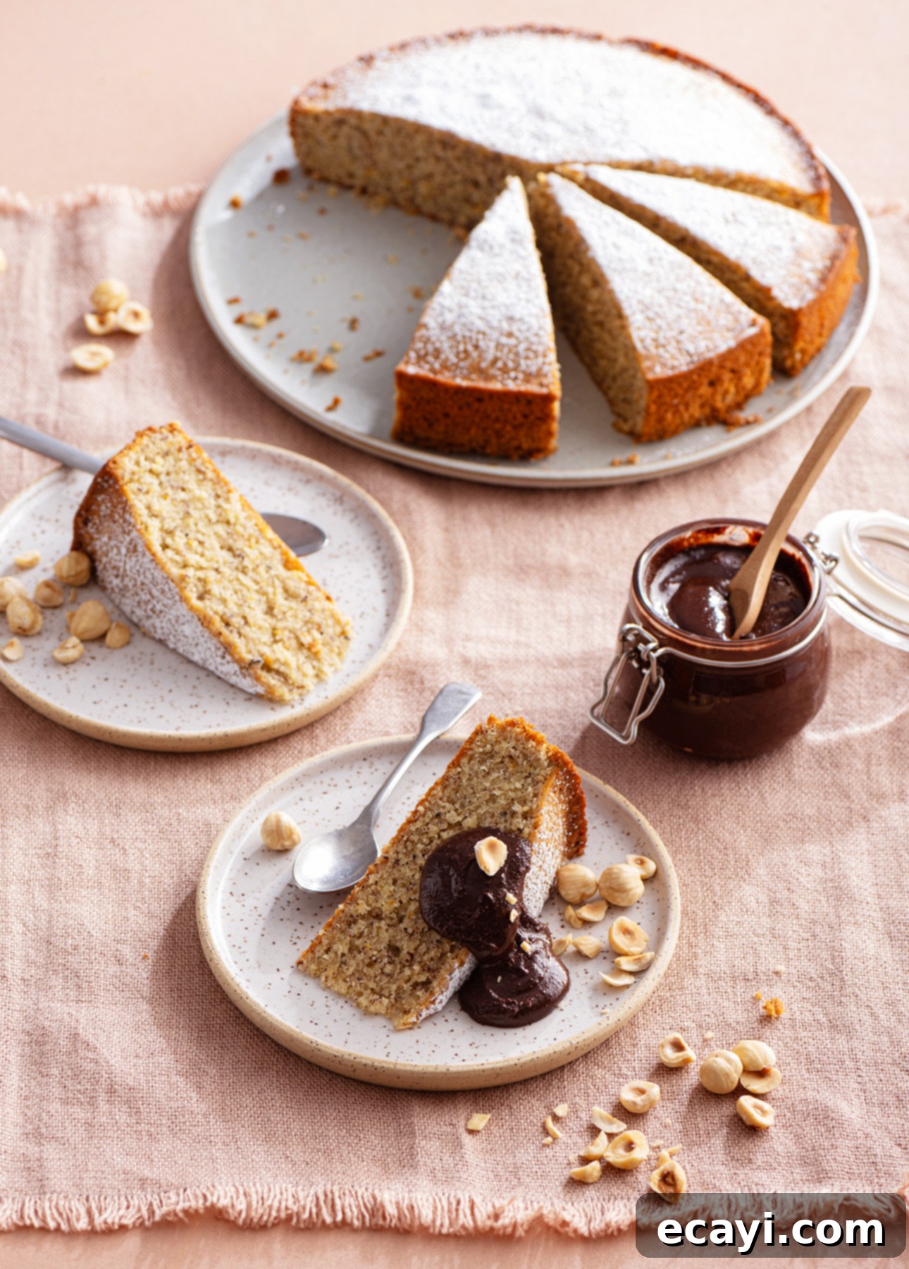 Classic Italian Hazelnut Torte 8 Torta di Nocciole (Italian Hazelnut Cake) served with a spoonful of homemade chocolate hazelnut spread