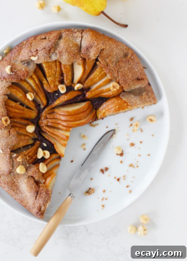 Rustic Pear & Chocolate Almond Galette 7 A slice of Pear and Chocolate Frangipane Galette showcasing the rich chocolate frangipane and tender pears. // FoodNouveau.com