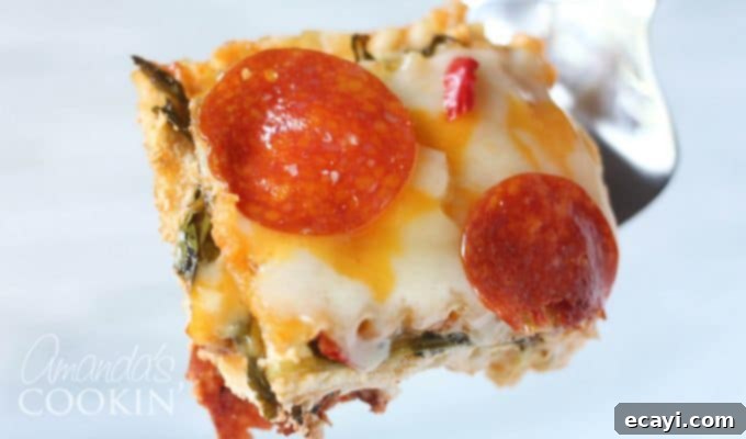 Pizzagna 17 A close up of a delicious slice of pizza lasagna on a plate.