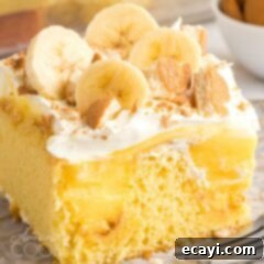 Luscious Banana Pudding Poke Cake 5 A piece of banana pudding poke cake on a plate