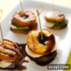 Smoky Peach Caprese 7 A close up of grilled peach caprese on a white platter.