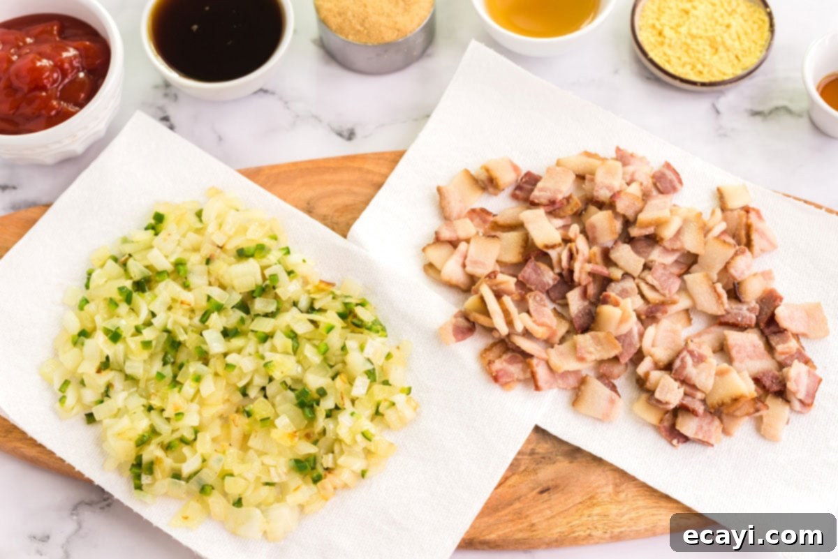 Grandma's Classic Baked Beans 5 onion mixture and bacon draining on paper towels