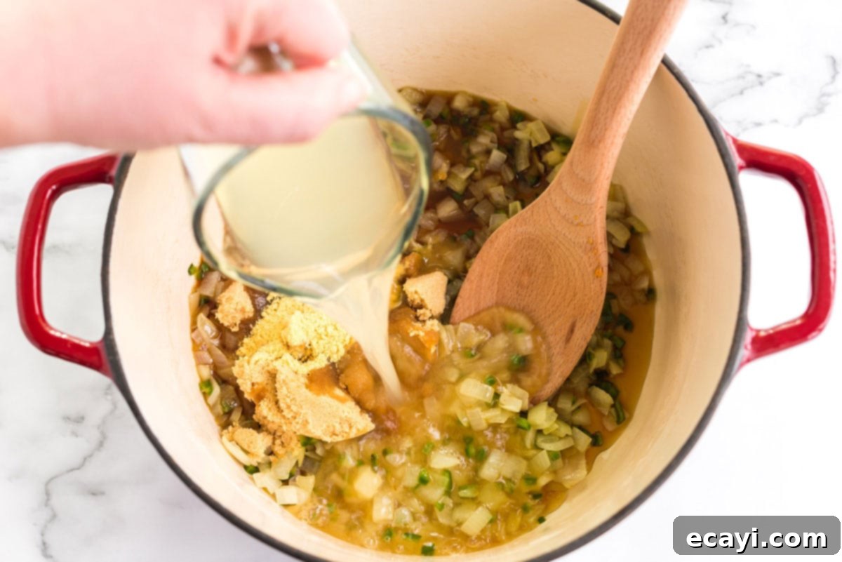Grandma's Classic Baked Beans 7 adding sugar and other ingredients to pan