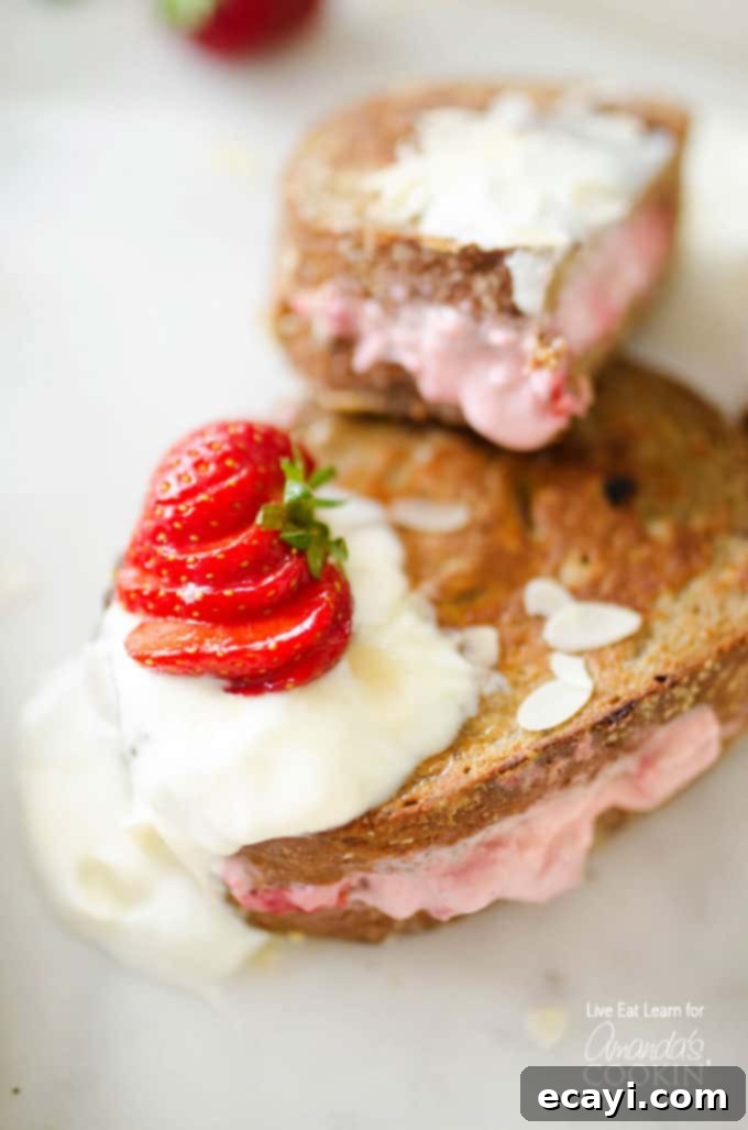 This French toast is stuffed with sweet strawberries and cream filling. Turn your usual breakfast into something amazing - Strawberry Stuffed French Toast! Golden French toast with fresh strawberries and cream cheese filling, dusted with powdered sugar