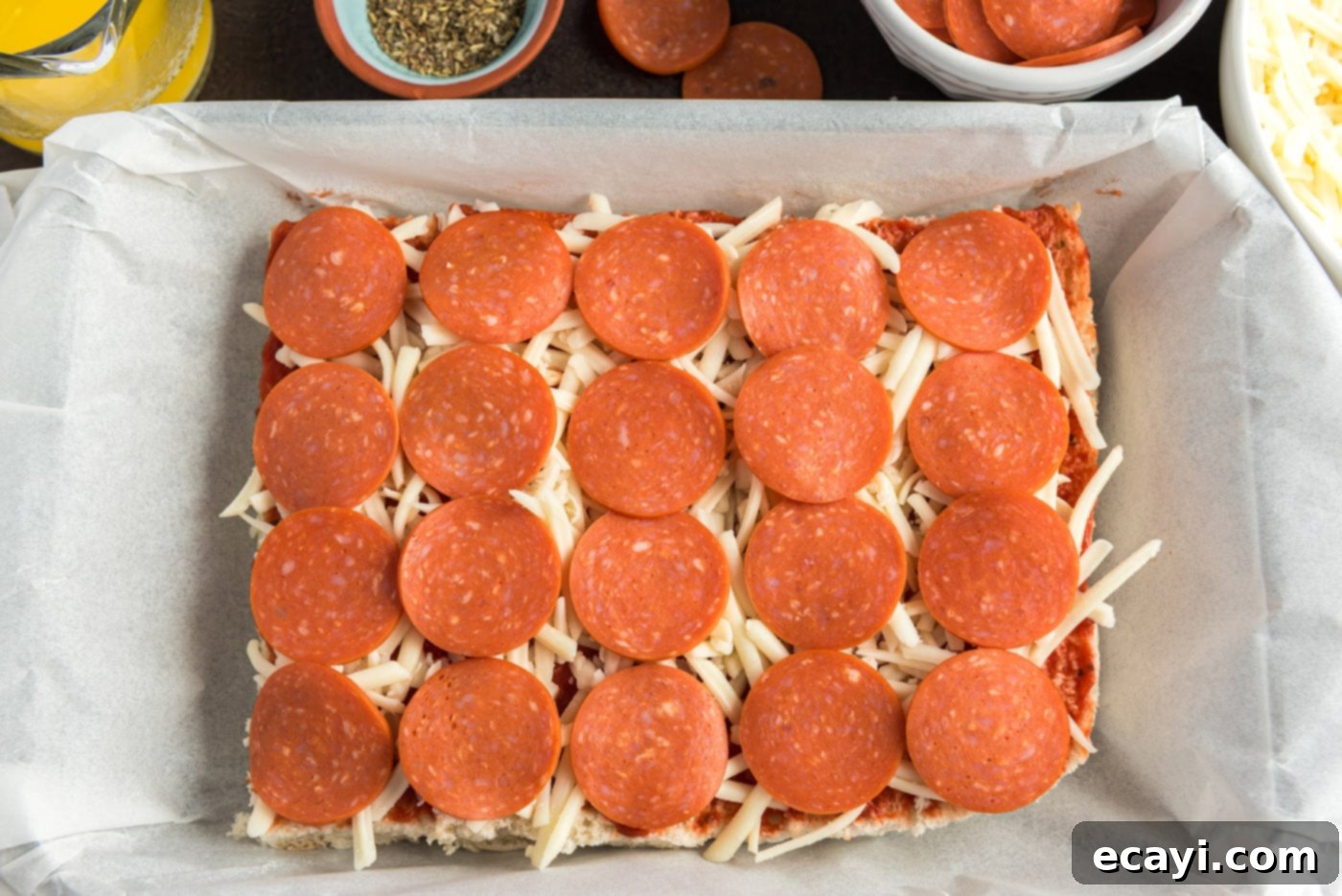 Cheesy Pizza Bites 8 Pepperoni slices neatly layered on top of mozzarella cheese and pizza sauce on the slider buns