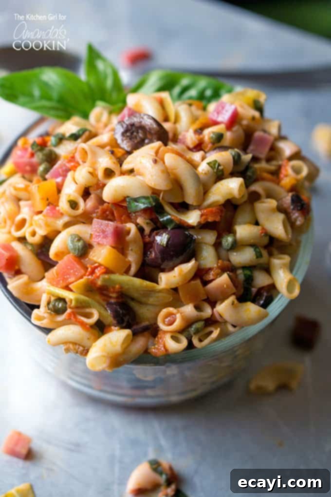 Sun-Drenched Mediterranean Pasta 2 A close up of a bowl filled with Mediterranean pasta salad.