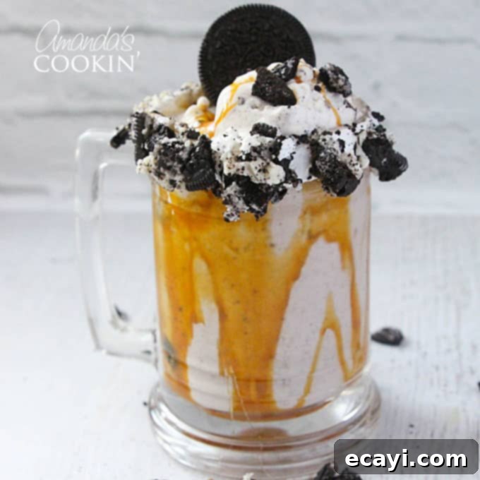 Freakshakes Wildly Indulgent Shakes 9 A mouth-watering close-up photo of a Double Caramel Cookie Crunch Freakshake, highlighting its intricate cookie and caramel toppings.