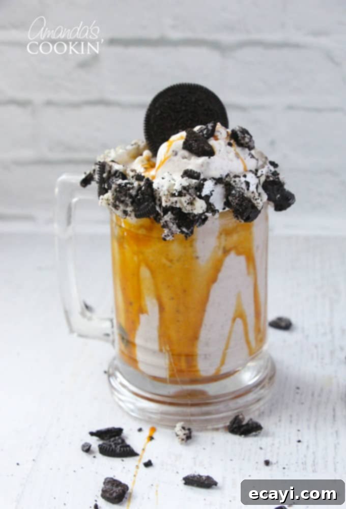 Freakshakes Wildly Indulgent Shakes 10 A close-up photo of a decadent Double Caramel Cookie Crunch Freakshake, expertly garnished and visually stunning, ready for enjoyment.