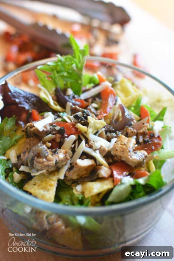 Freshly mixed Chicken Fajita Salad with succulent chicken and vibrant bell peppers Chicken Fajita Salad mixed in a large bowl, showcasing colorful vegetables and grilled chicken