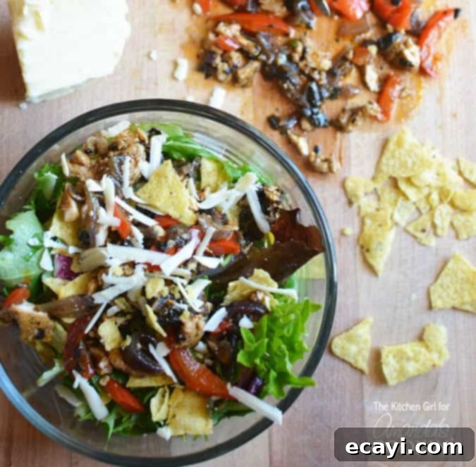 Zesty Chicken Fajita Salad with fresh lime A bowl of freshly prepared Chicken Fajita Salad with lime wedges